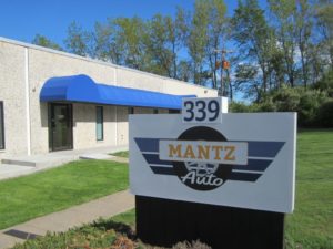 Close up of the Mantz Auto office sign in Milldale, CT
